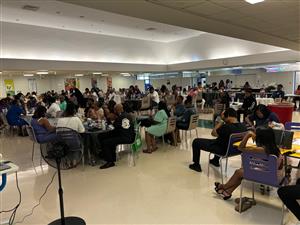 people sitting at tables eating