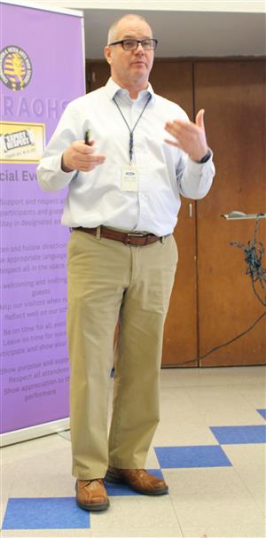 Presenter talking to students