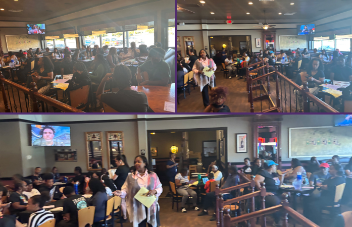  people at a restaurant eating 