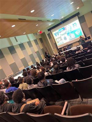 Students listening to presenter