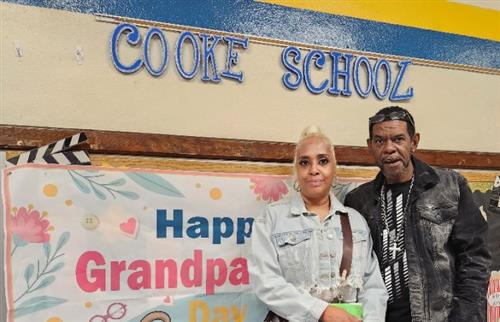  Two adults standing in the hallway