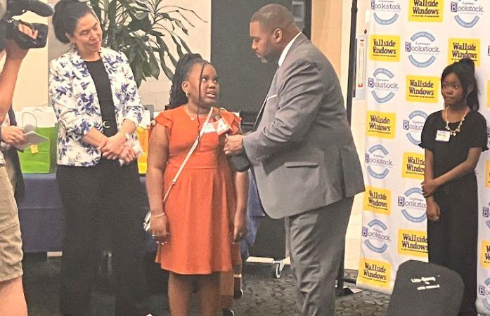  Little girl accepting award