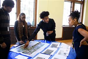 Scholars presenting their senior internships