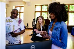 Scholars presenting their senior internships