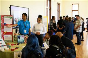 Scholars presenting their senior internships