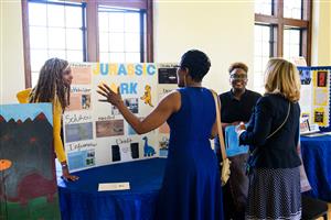 Scholars presenting their senior internships
