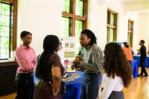 Scholars presenting their senior internships