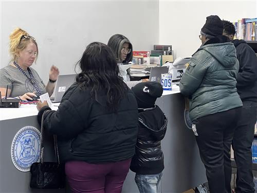 people in line at the SOS mobile unit in the hallway