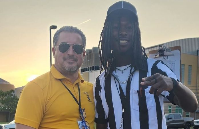  Mr. King with his former student on the football field