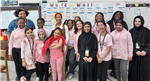 teachers, students and a speaker standing in class  
