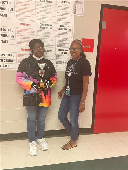Student holding Trophy