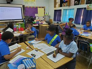 Students working together to practice math problems