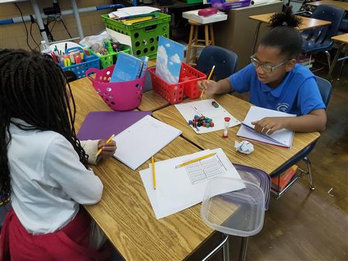Students solving equations