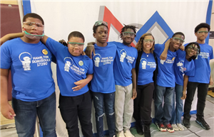 robotics teams posing together