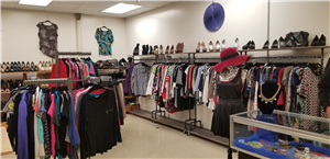 A picture of clothes hung in a store