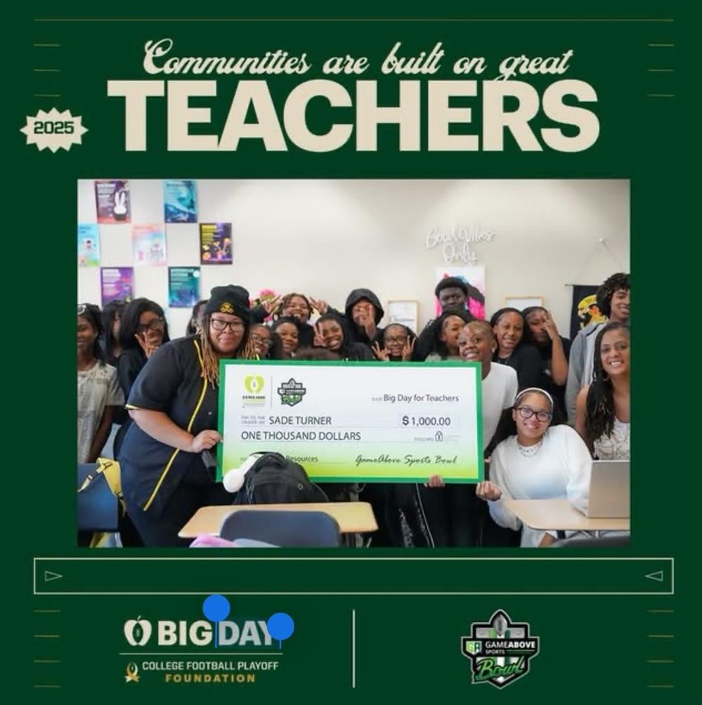  Ms. Turner stand with students in her class with a large check 