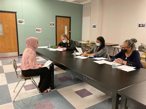 student presenting to panel