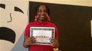 young lady with honor certificate