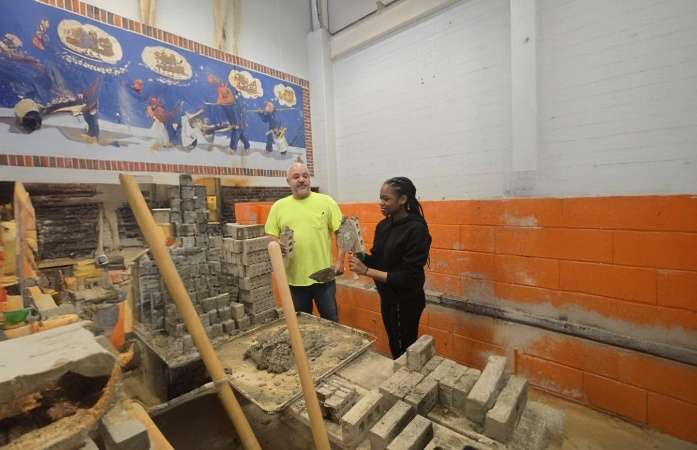  Student laying bricks