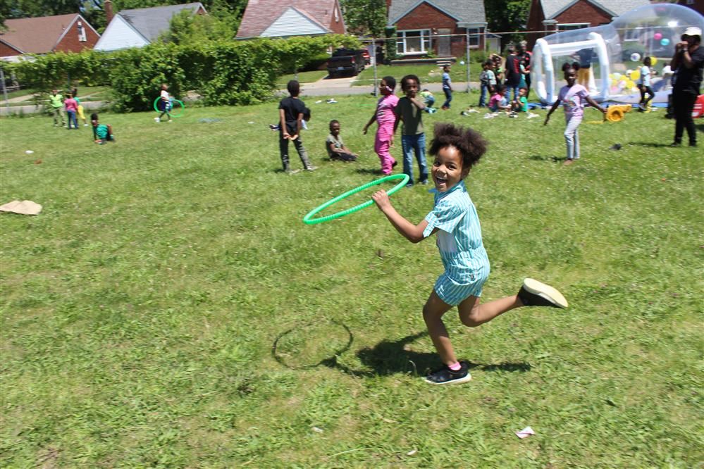  student runs with hula hoop
