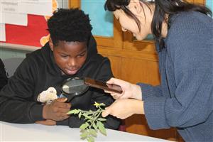  Ms. AJ shares foods harvested in the garden.