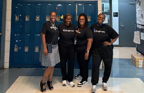  4 ladies standing and smiling
