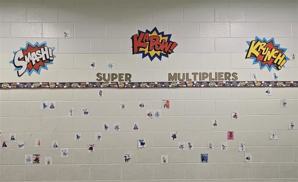  display on brick wall with drawings of super heroes 