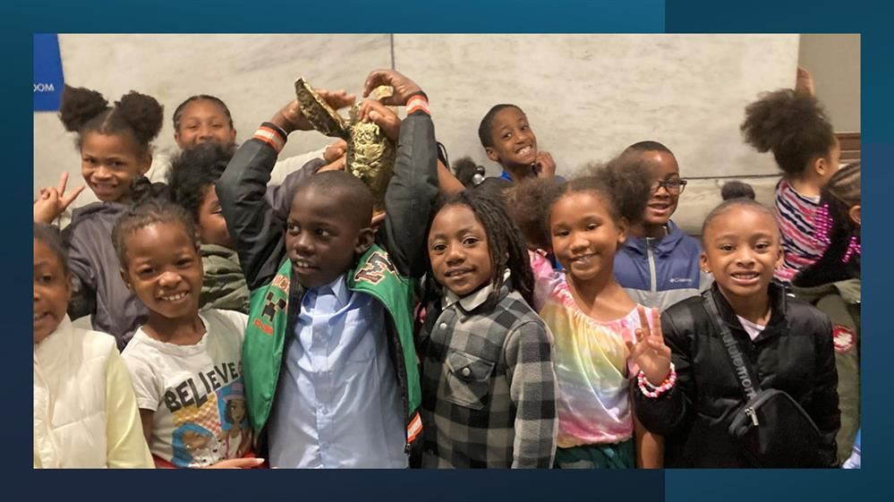  a small group of 2nd grade students smiling