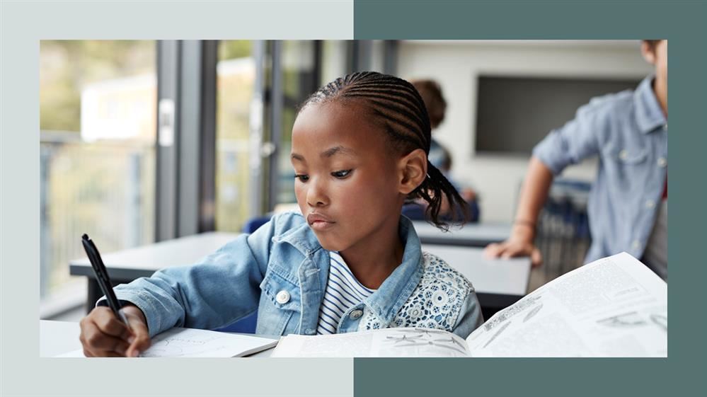  little brown girl writing