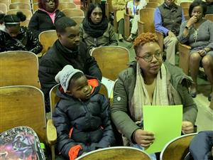 parents listening to curriculum presentation 