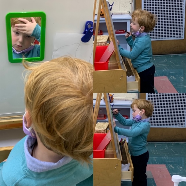  Young boy drawing a self-portrait 