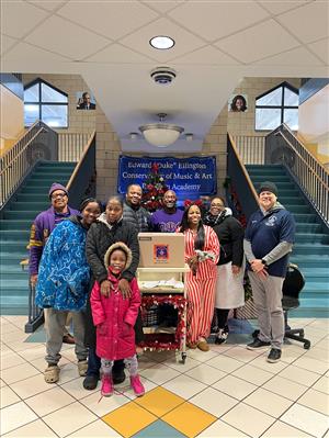 Families receiving food basket from a support