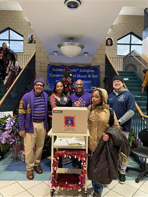 A joyful group of giver making a holiday  for a family much brighter