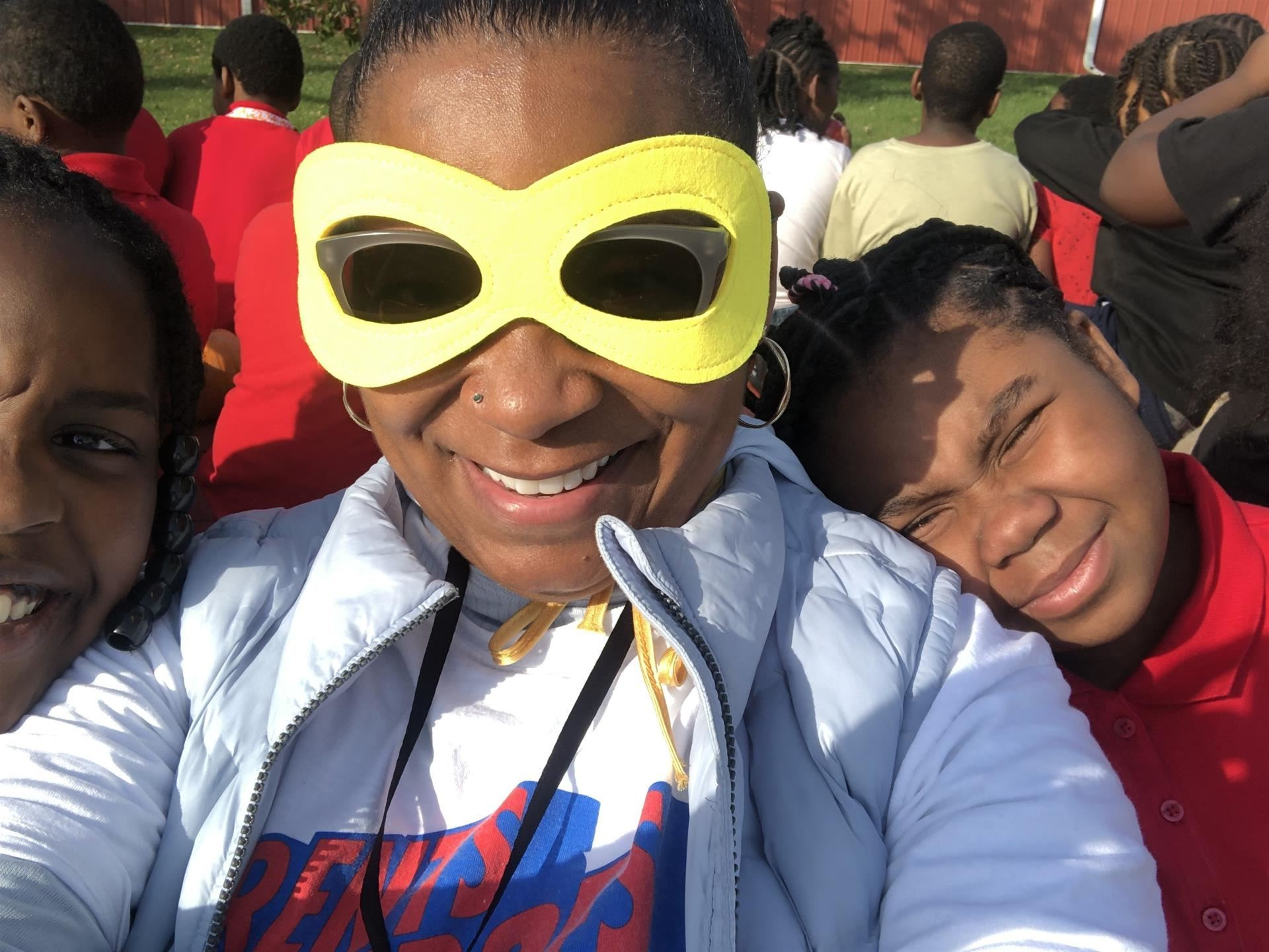 students with teacher at apple orchard