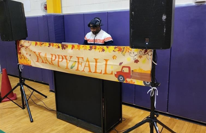   DJ playing music at a school dance.