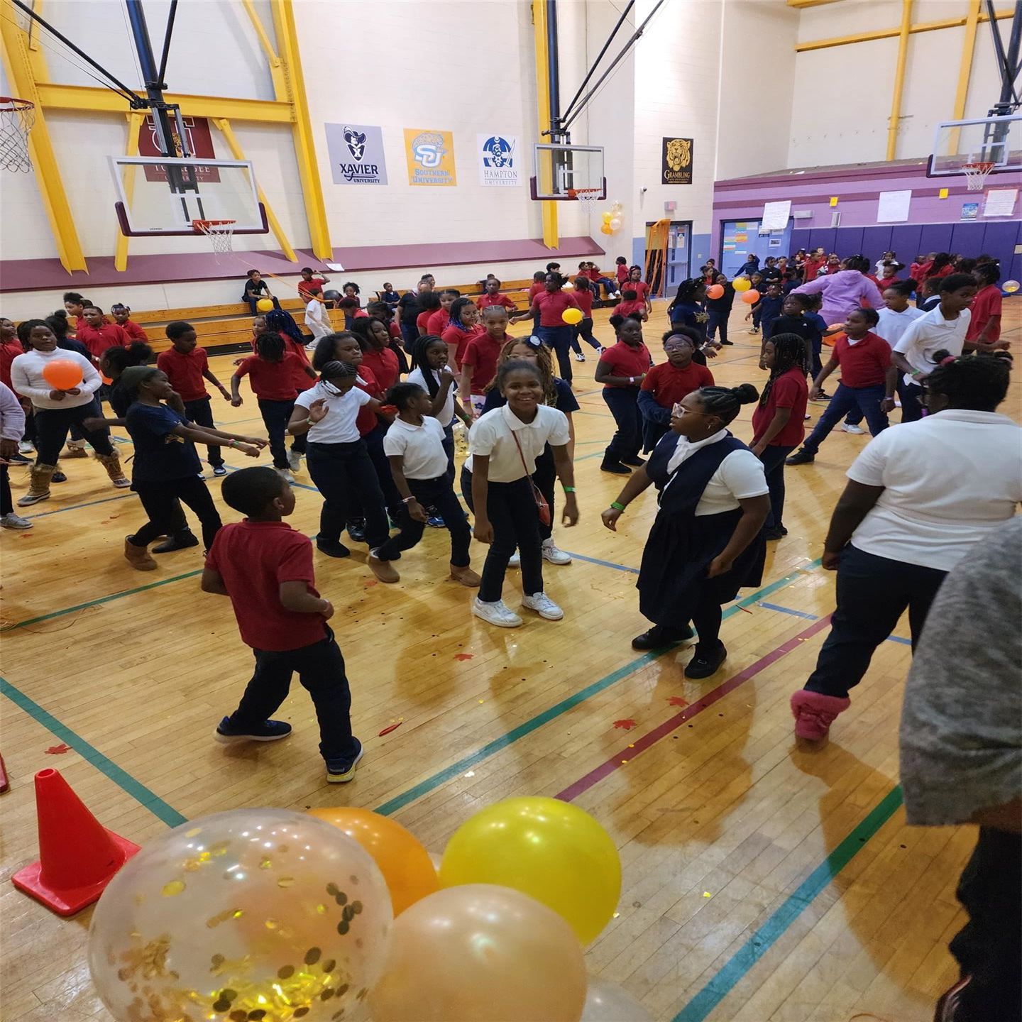 Students dancing in groups during school dance.