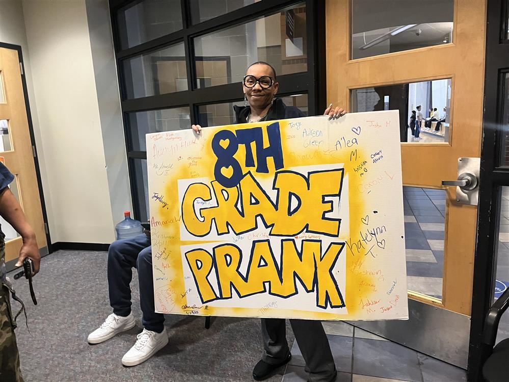  principal holding sign