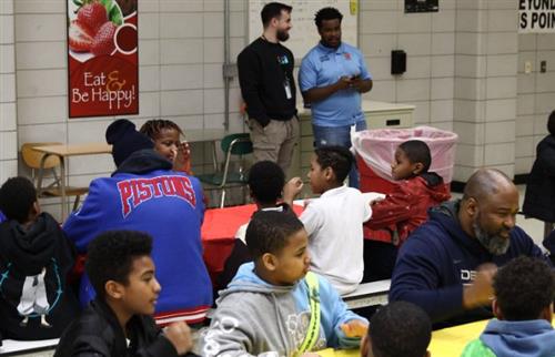 students and teachers together in the cafeteria