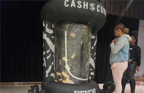 blow up cash cube with school "bucks" floating inside