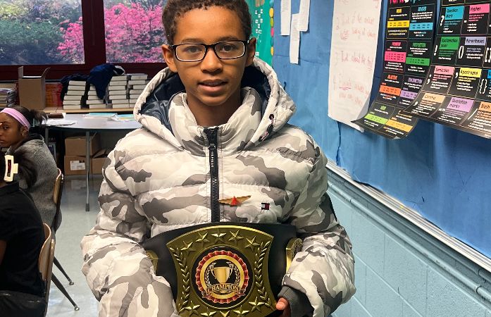  Student holding a gold medal