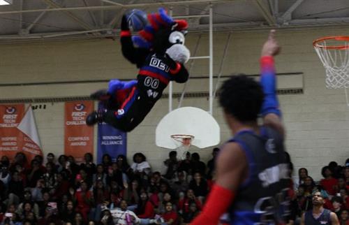  Detroit Pistons mascot flying in the air to shot a basket