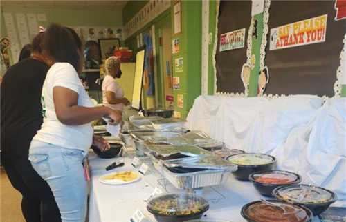 teachers making plates at taco bar