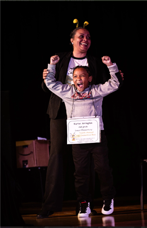 1st place winner on stage celebrating his win