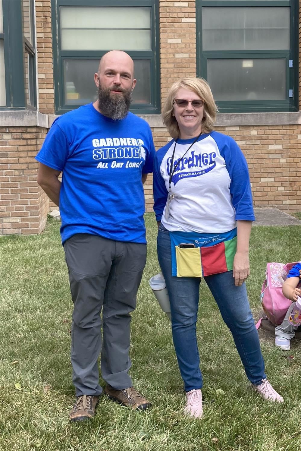  Teachers standing outside school with Gardner Gear on.