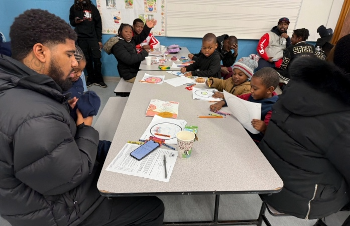  students and dads sitting at table