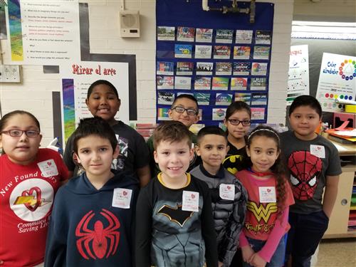 2nd Graders wearing Super Hero gear and their Count Day stickers 