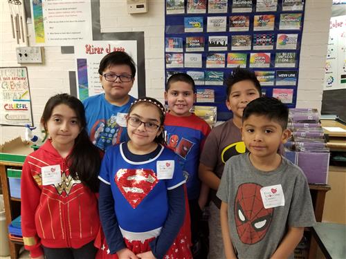 3rd Graders wearing Super Hero gear and their Count Day stickers 