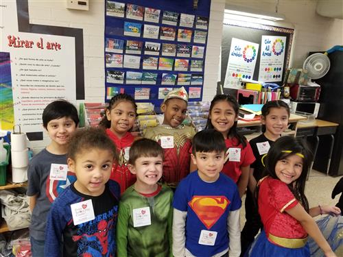 KDG and 1st Graders wearing Super Hero gear and their Count Day stickers  
