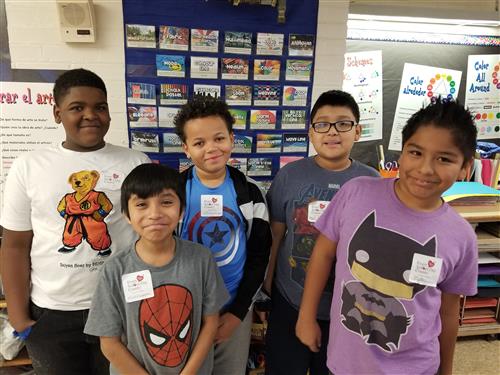5th Graders wearing Super Hero gear and their Count Day stickers  
