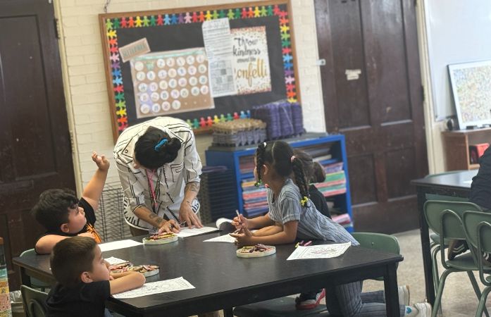  Teachers and students working. 